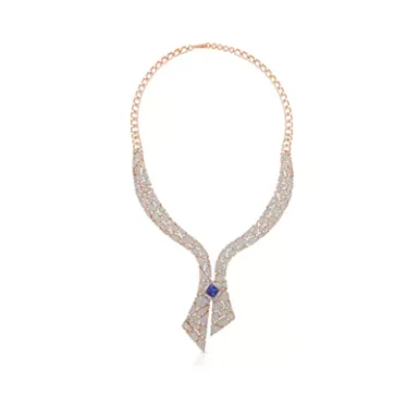Elegant silver necklace with a blue gemstone accent and intricate design.