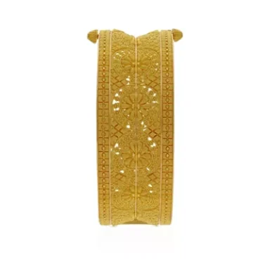 Gold bangle with intricate floral and geometric patterns.