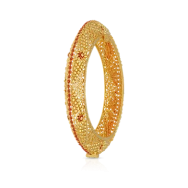 Gold bangle adorned with intricate designs and red embellishments.