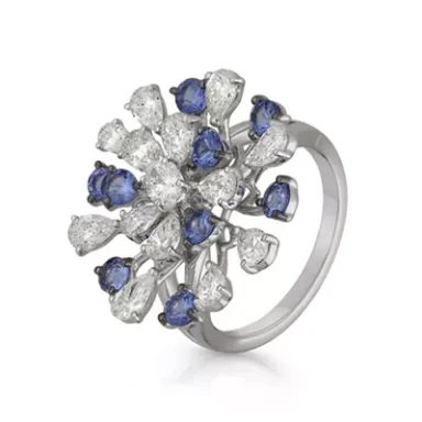 Silver ring featuring a cluster of blue sapphires and diamonds in a floral design.