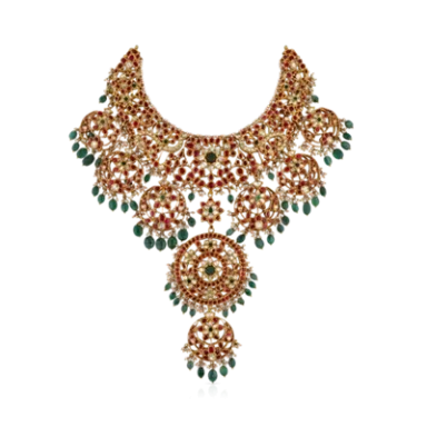 Ornate gold necklace with red and green embellishments, featuring intricate designs and pendants.
