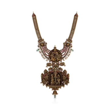 Traditional Indian necklace with ornate design featuring intricate embellishments and gemstones.