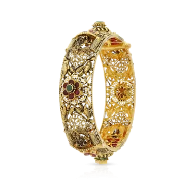Intricate gold bangle with floral motifs and colourful stone accents.
