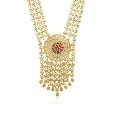 Gold necklace with intricate design and central red stone embellishment.
