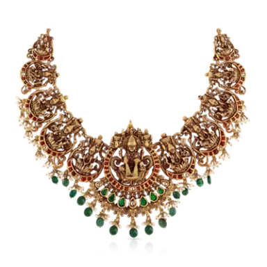 Intricate gold necklace adorned with red and green gemstones.