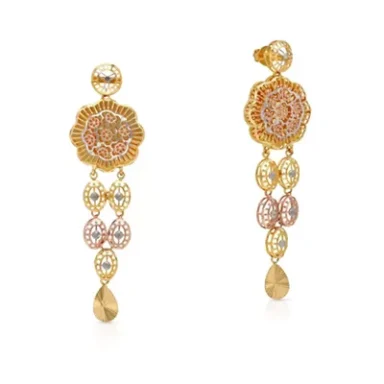 Gold earrings with intricate floral design and hanging gemstone accents.