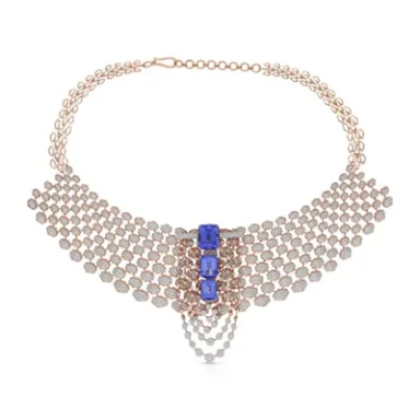 Rose gold necklace with blue stones and layered chain design.