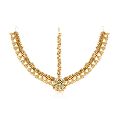 Gold necklace with intricate chains and a floral centrepiece featuring green stones.