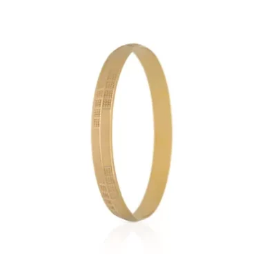 A simple gold bangle with a textured pattern.