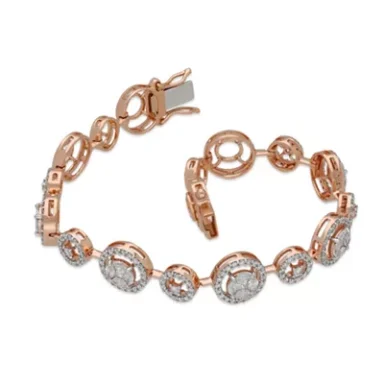 Rose gold bracelet with circular links and clear gemstones.