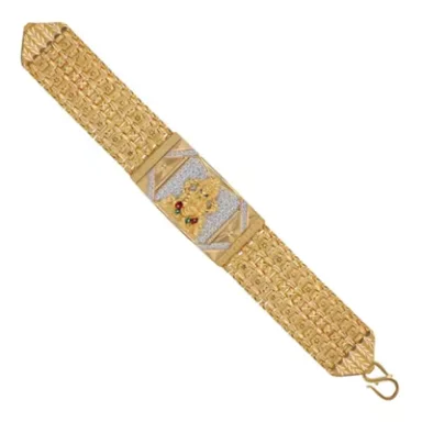 Gold bracelet with intricate design and a central decorative element featuring red accents.