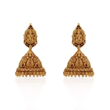 Intricately designed gold earrings with traditional motifs and decorative details.