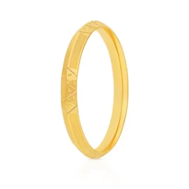 A plain gold bangle with subtle engraved geometric patterns.