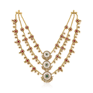 Elegant gold necklace with red and white gemstones, featuring three ornate pendants.