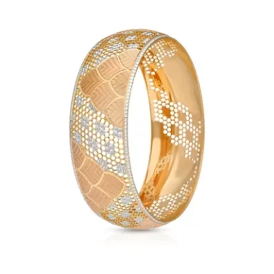 Gold bangle with a textured pattern and embedded diamonds, showcasing elegant design.