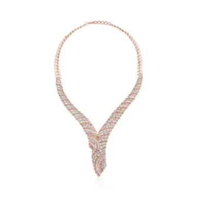 Elegant silver and rose gold necklace with a twisted design and sparkling accents.