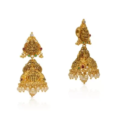 Intricately designed gold earrings featuring deity motifs and pearl embellishments.