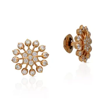 Gold flower-shaped earrings adorned with clear gemstones.