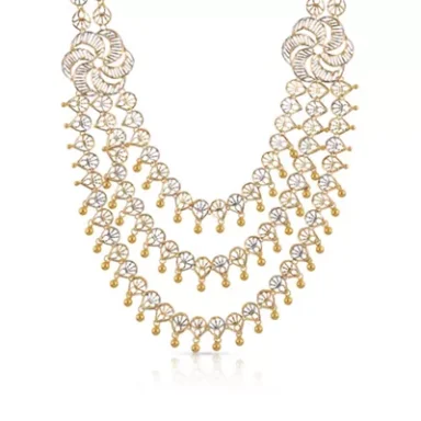 Gold and rosegold necklace with layered design and decorative gemstone embellishments.