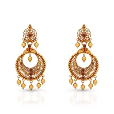 Gold earrings with intricate designs and hanging beads.